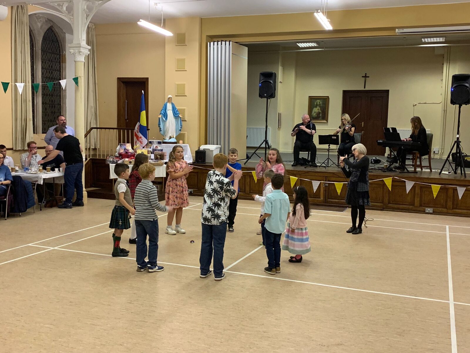 Children dancing with live musicians