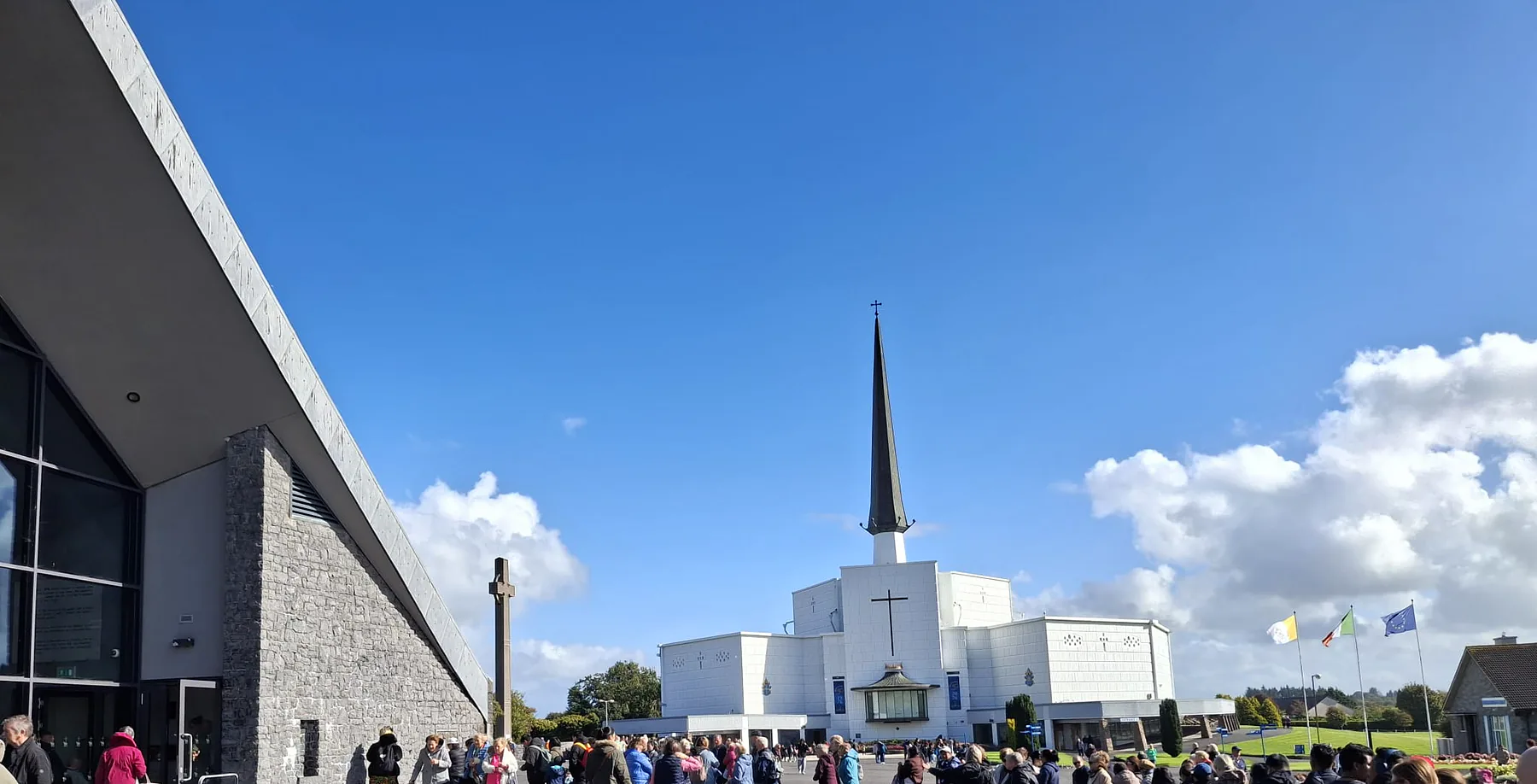 Pilgrims queueing across the shrine grounds towards the Basilica of Our Lady, Queen of Ireland