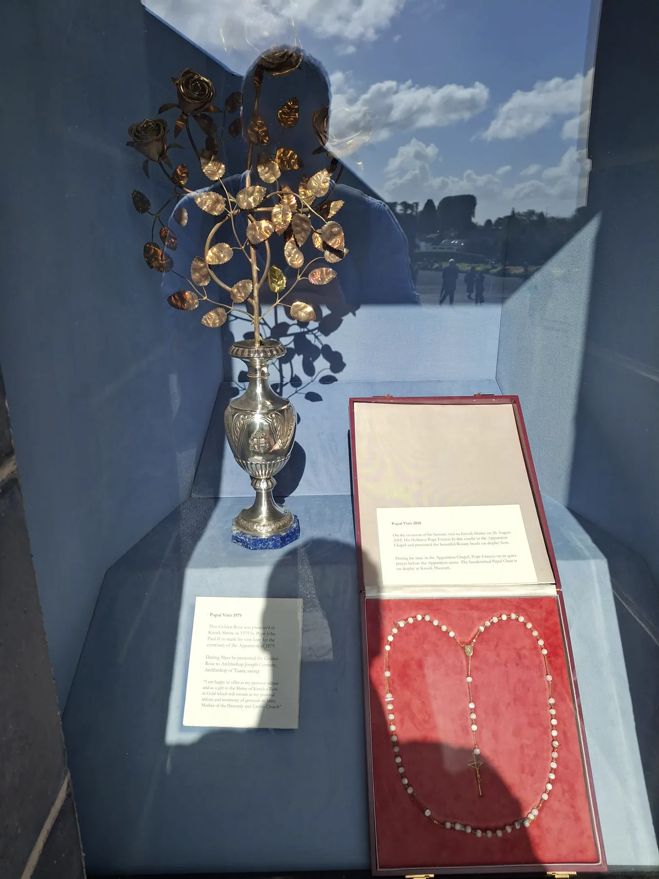 The Golden Rose presented to Knock by Pope St John Paul II in 1979, beside the rosary Pope Francis gave the shrine in 2018