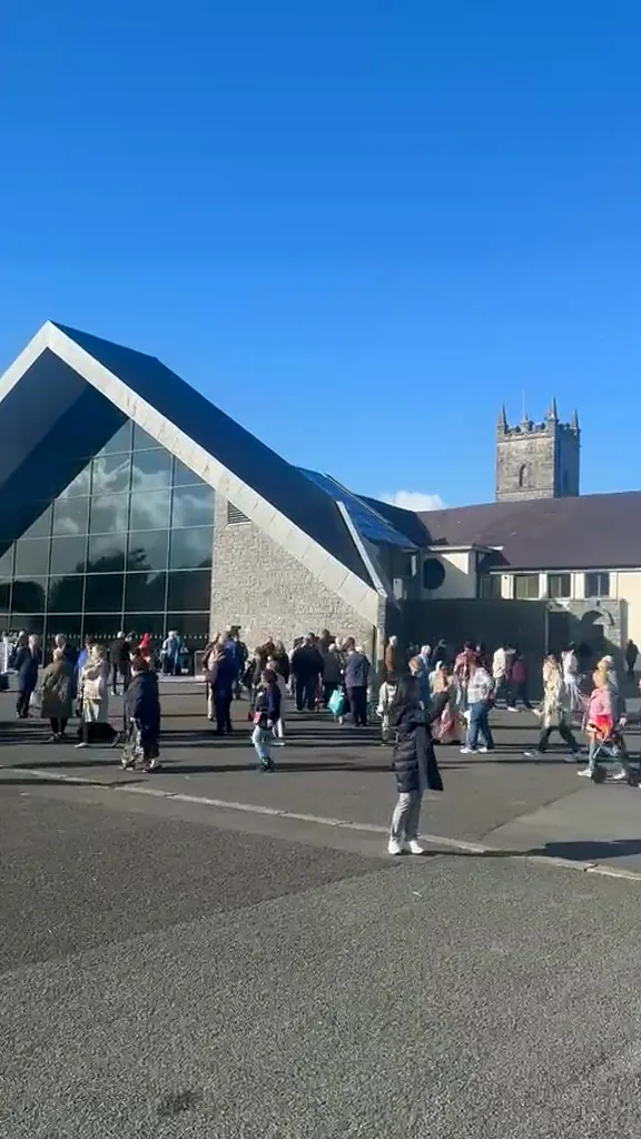 The Apparition Chapel and the shrine grounds in the afternoon sun