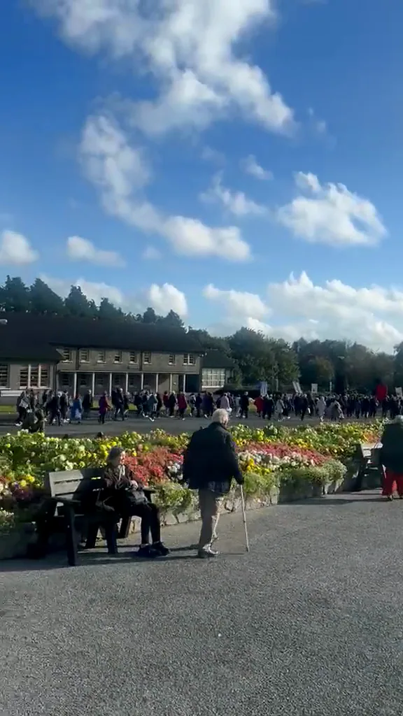 A walk across the shrine grounds, past the Apparition Chapel, the high cross and the Basilica to the flower beds