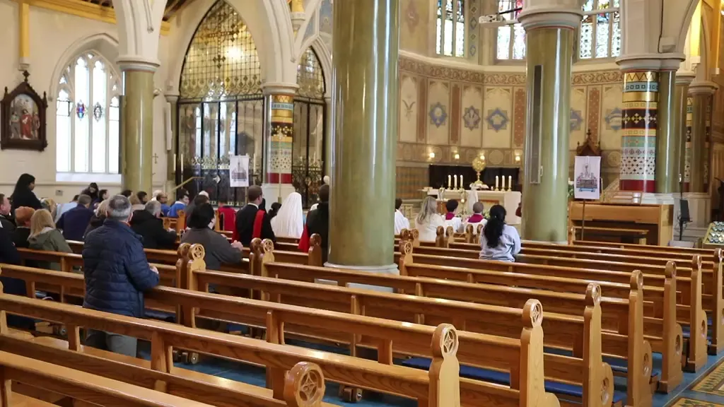 The procession comes into the church at the end of the walk, the altar servers and banners going up the aisle