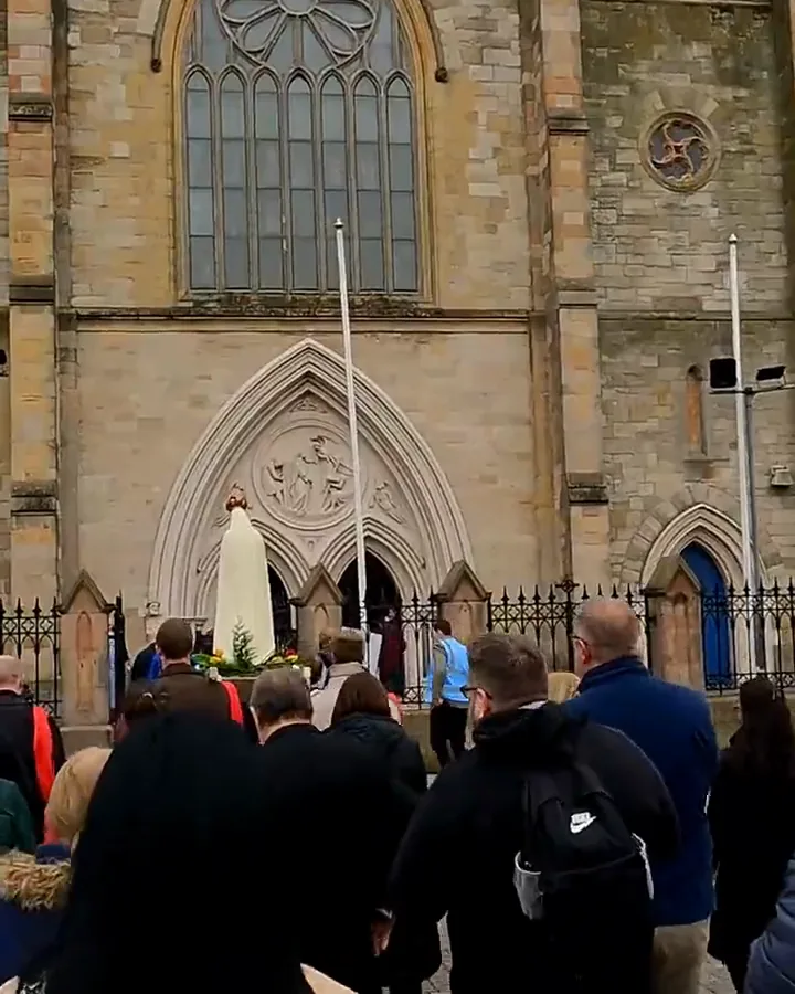 The procession arriving at the front of St Peter’s Cathedral, Belfast, with a statue of Our Lady at the door.